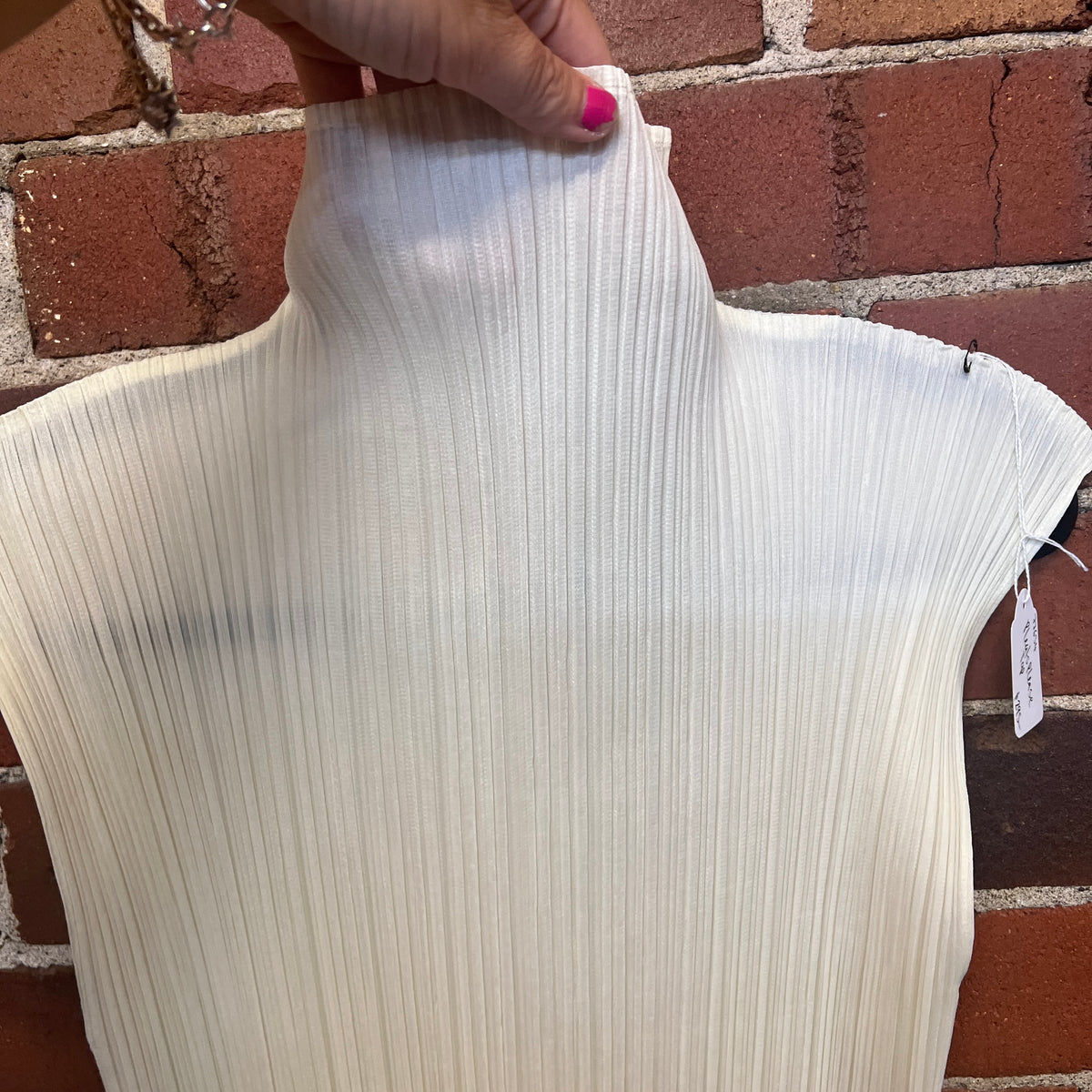 PLEATS PLEASE ATOP