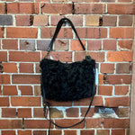 DEADLY PONIES SHEARLING AND LEATHER HANDBAG