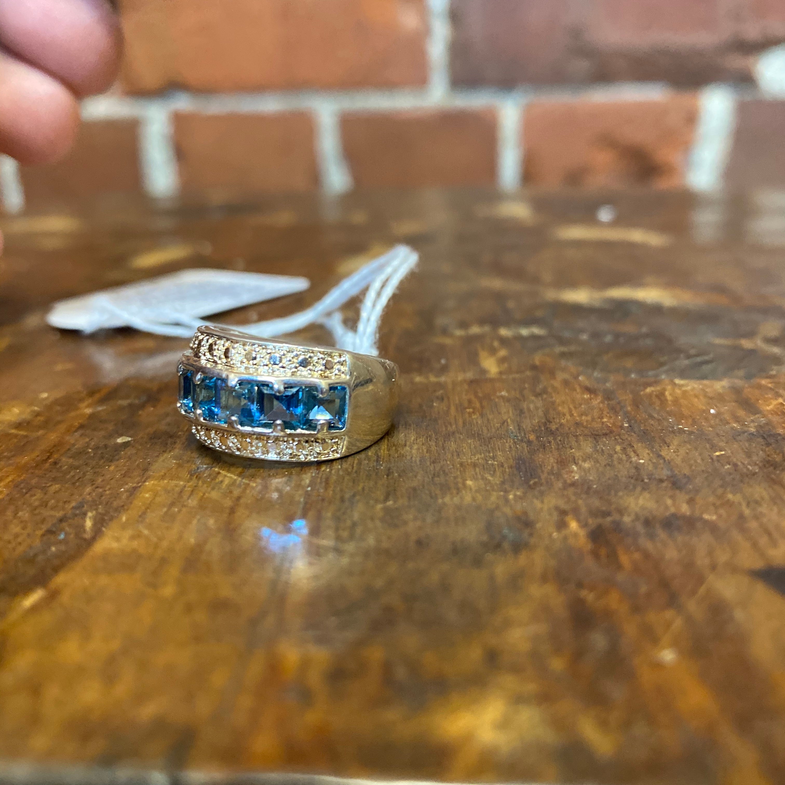 Sterling silver and emerald cut, blue topaz ring