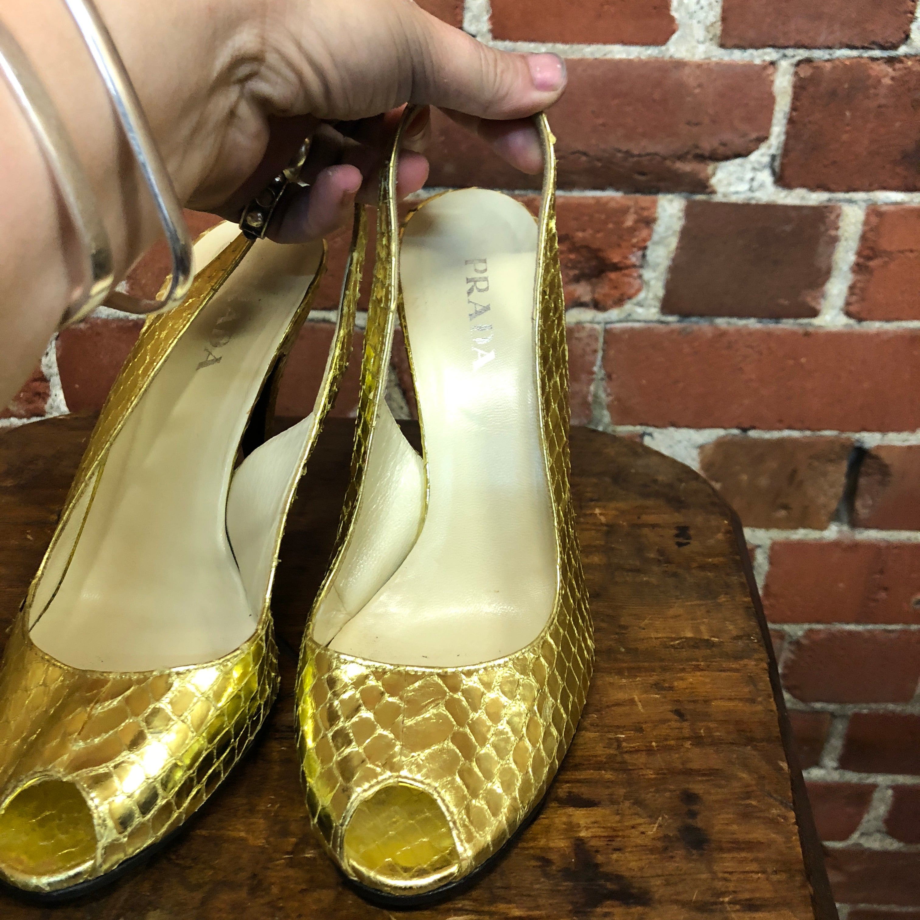 PRADA gold snakeskin slingback heels