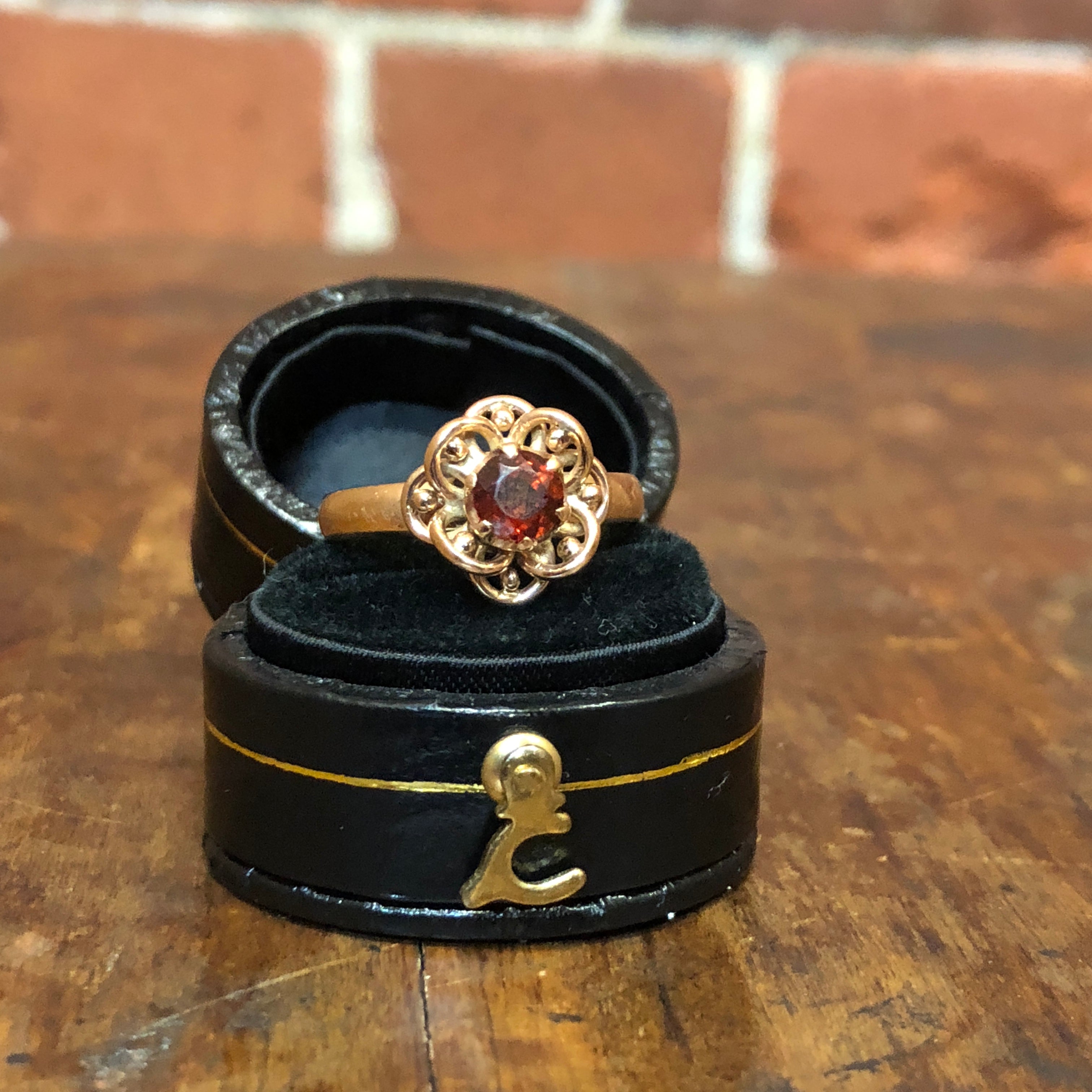 9ct gold and garnet flower ring