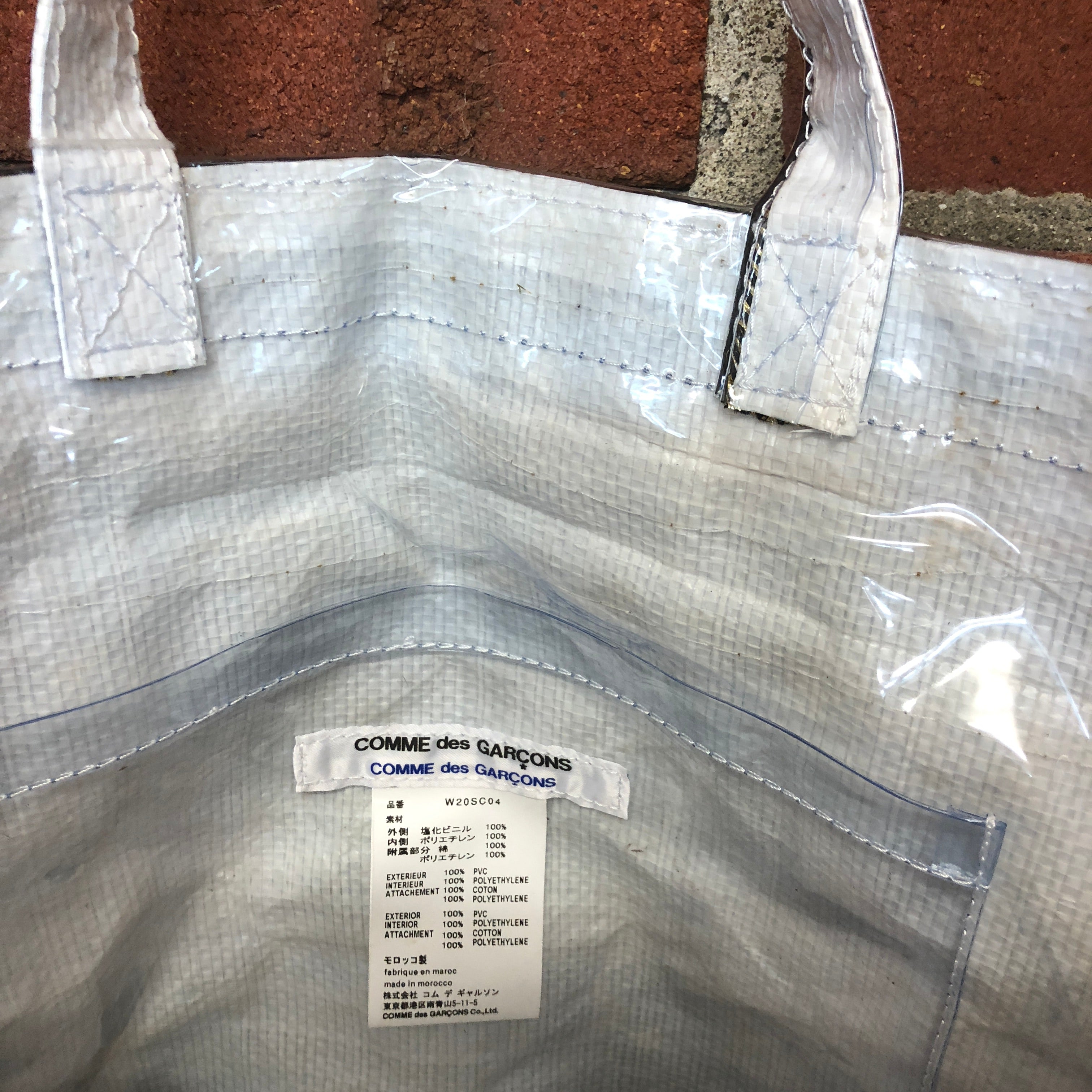 COMME DES GARCONS plastic covered bag